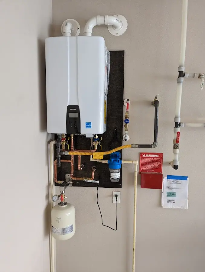 Professional plumber installing copper piping in a East Whittier home